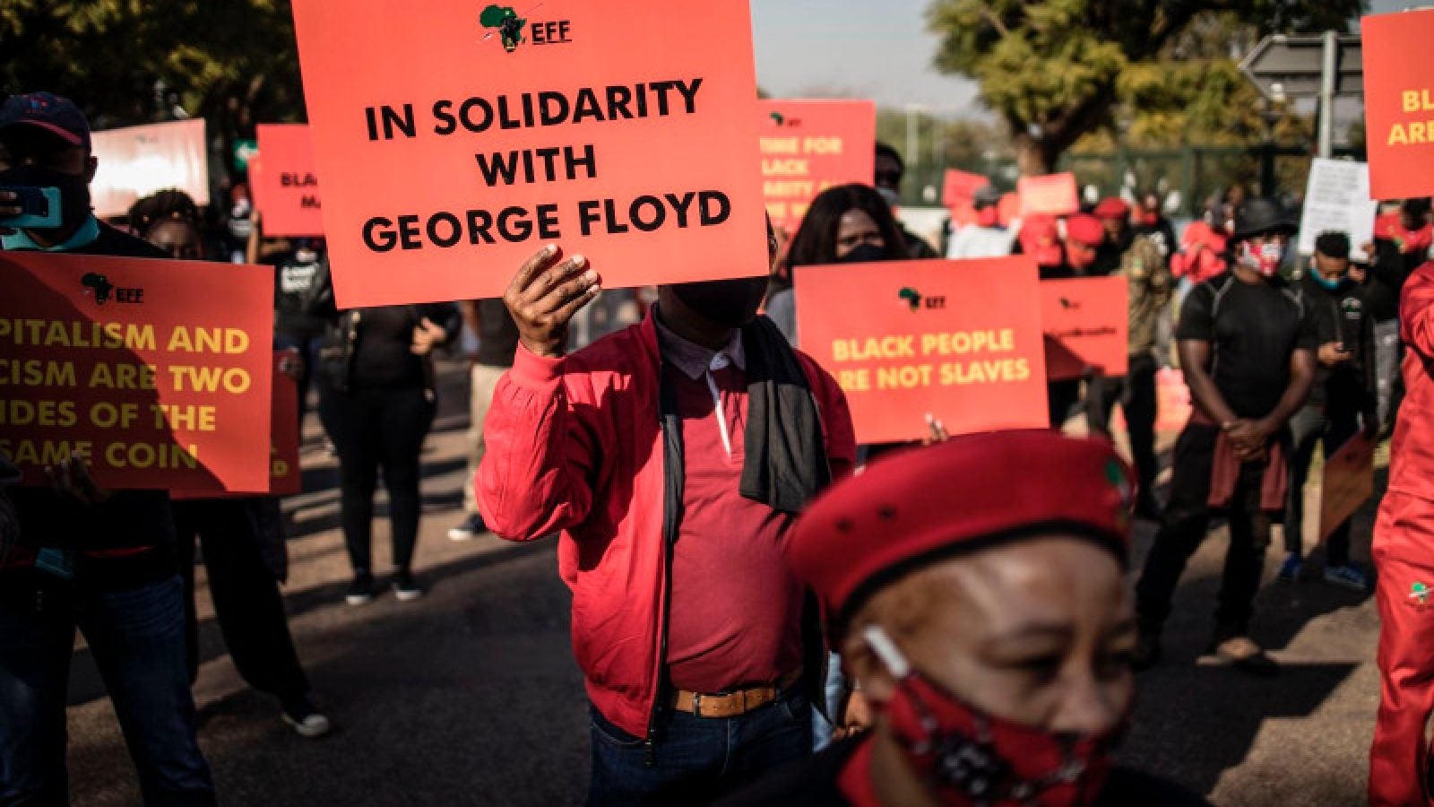 Economic Freedom Fighters supporters hold Black Lives Matter signs in front of the U.S. Embassy in Pretoria