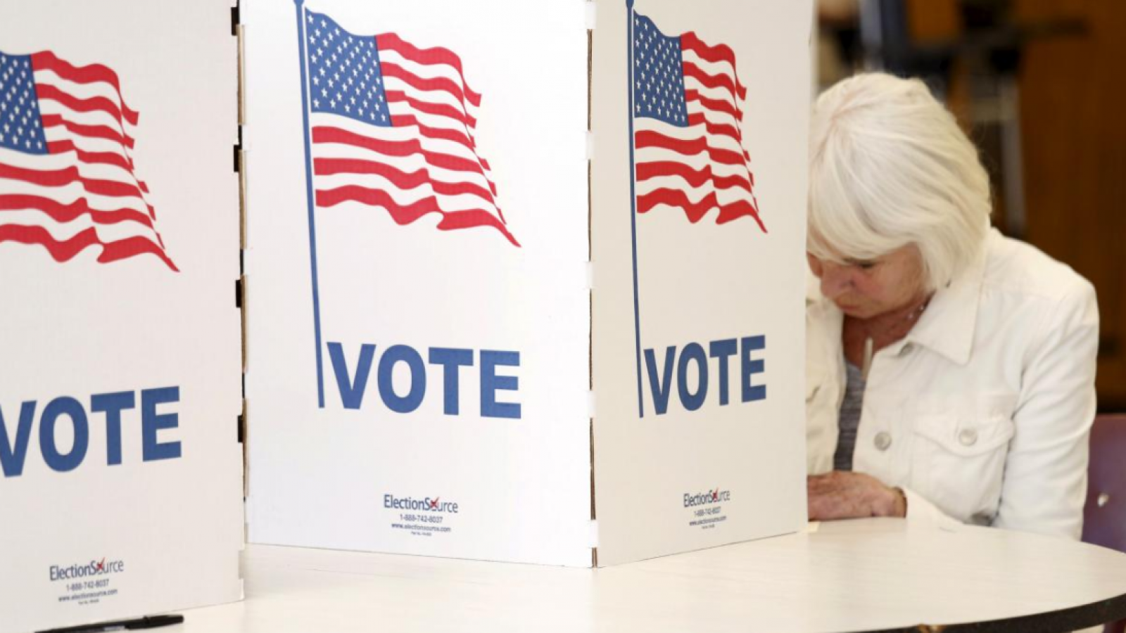 A woman at a voting booth