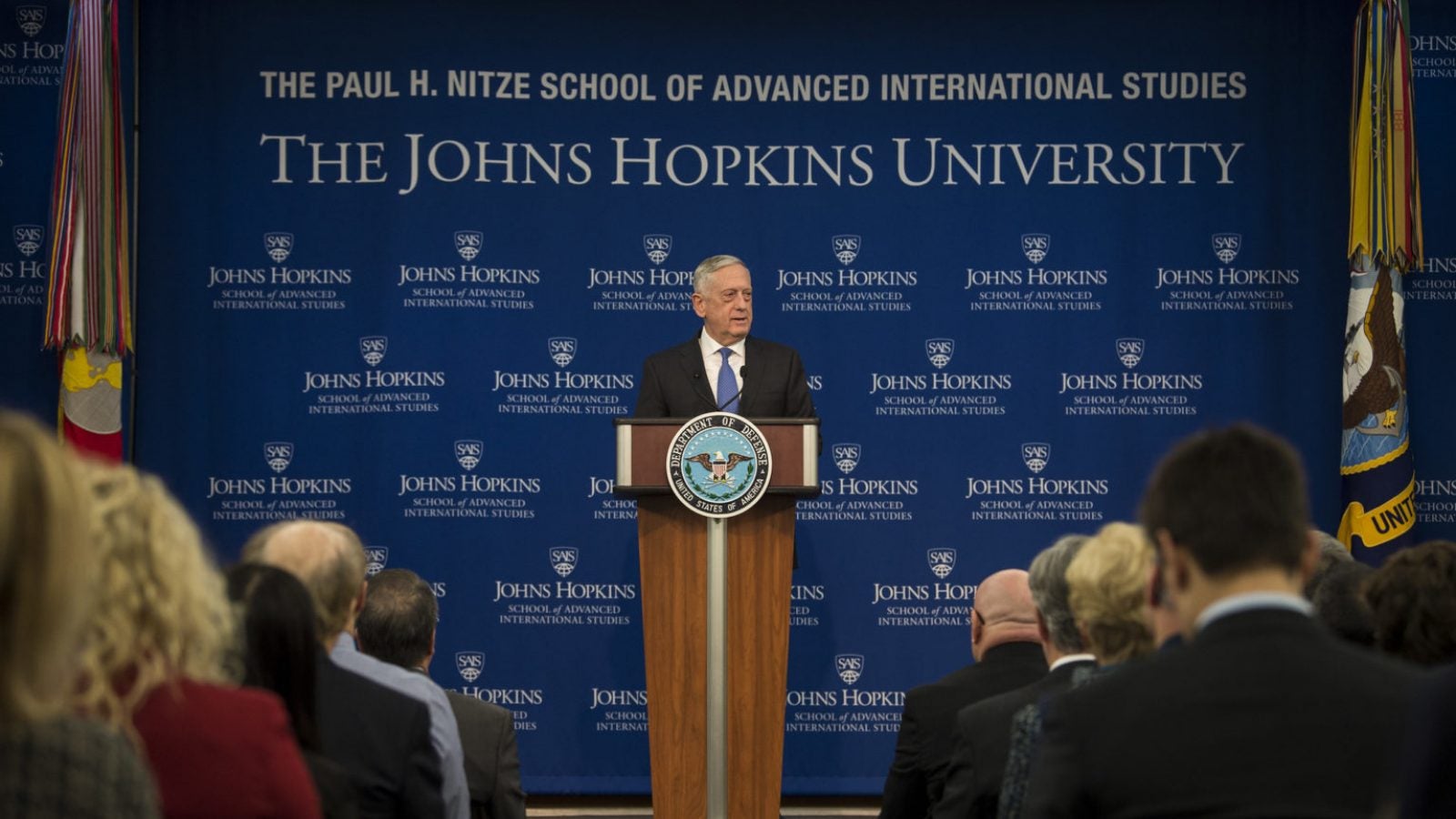 General Mattis speaks to an audience behind a podium at Johns Hopkins University School of Advanced International Studies