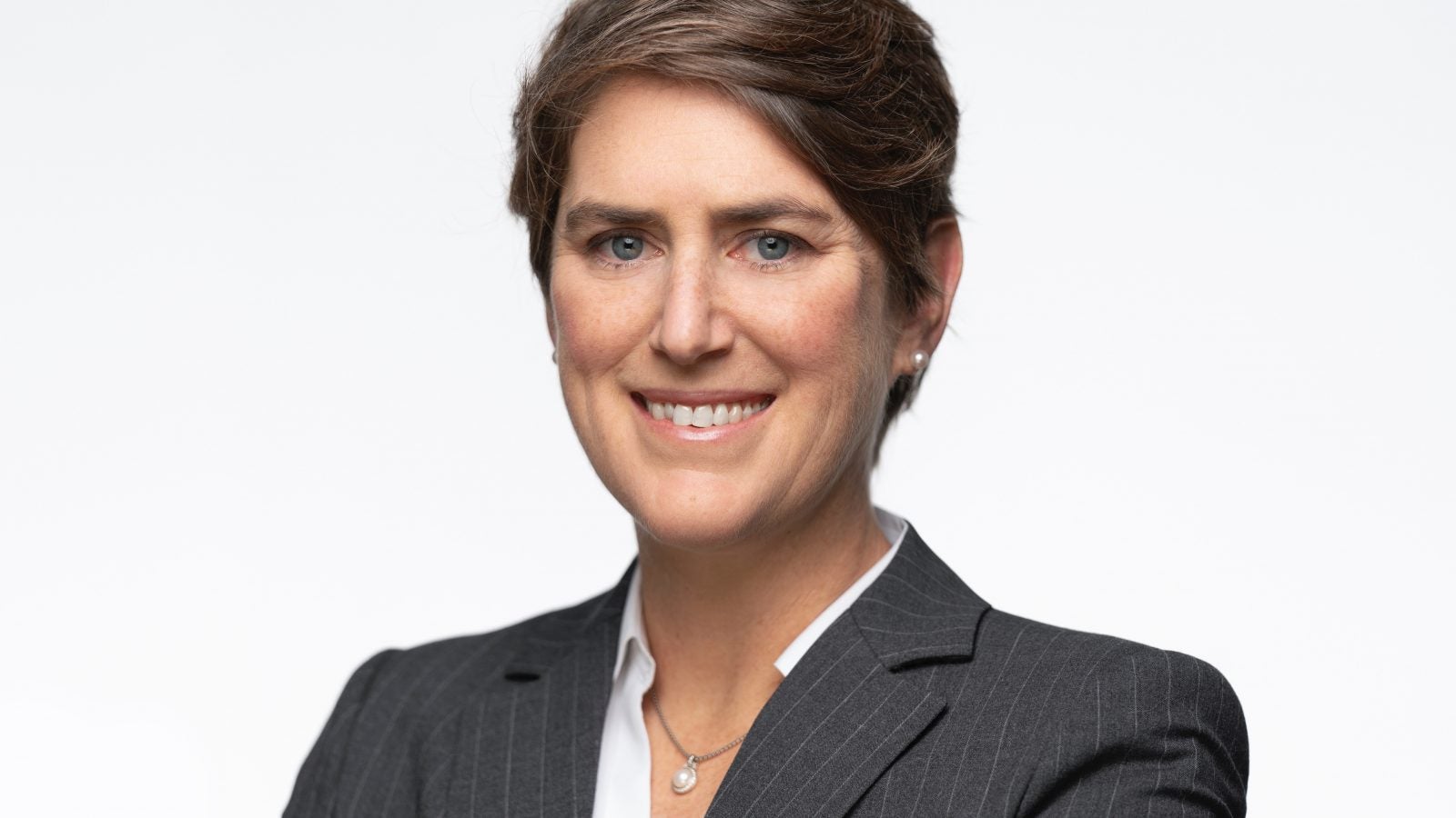 A headshot of Professor Kyleanne Hunter against a white background