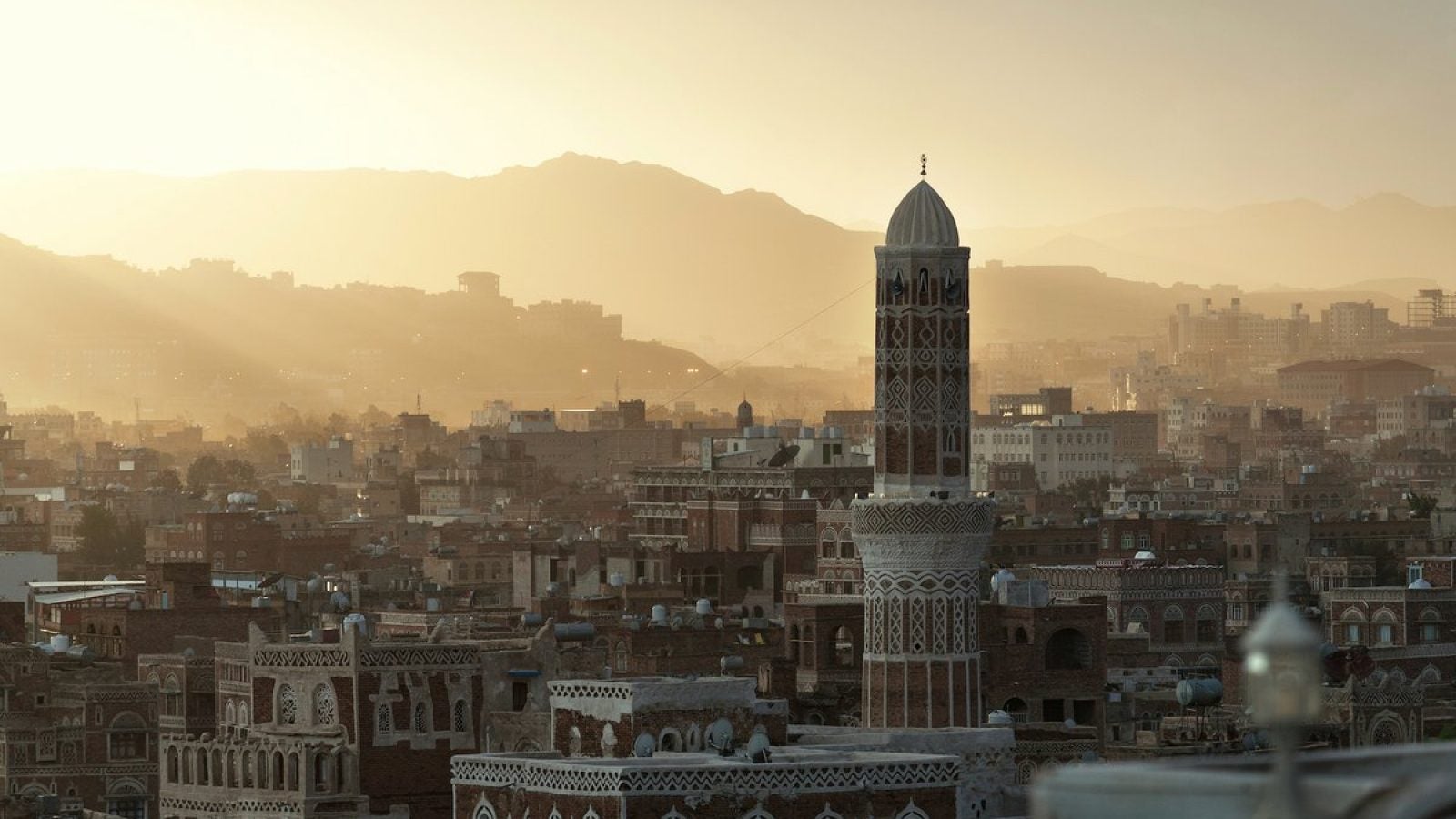 A cityscape during golden hour in Yemen