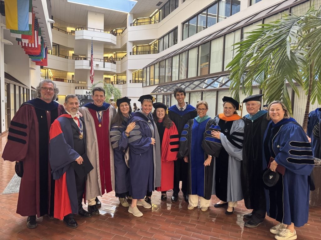 SSP Professors pose for a group photo in their academic regalia