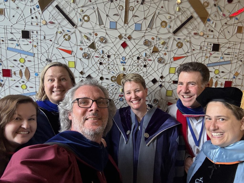 From left: Drs. Jennifer Jefferis, Rebecca Patterson, Keir Leiber, Heidi Urben, Dan Byman, and Sara Moller pose for a selfie before Commencement 
